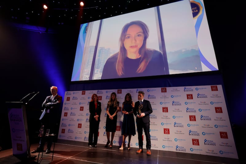 Sally Hayden speaks onscreen from abroad to accept the 2025 Irish Journalism Awards Journalist of the Year award. Photograph: Alan Betson/The Irish Times