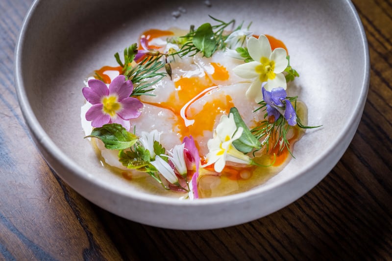 Scallop crudo, saffron sabayon, spring flowers at The Glass Curtain, Cork. Photograph: Joleen Cronin