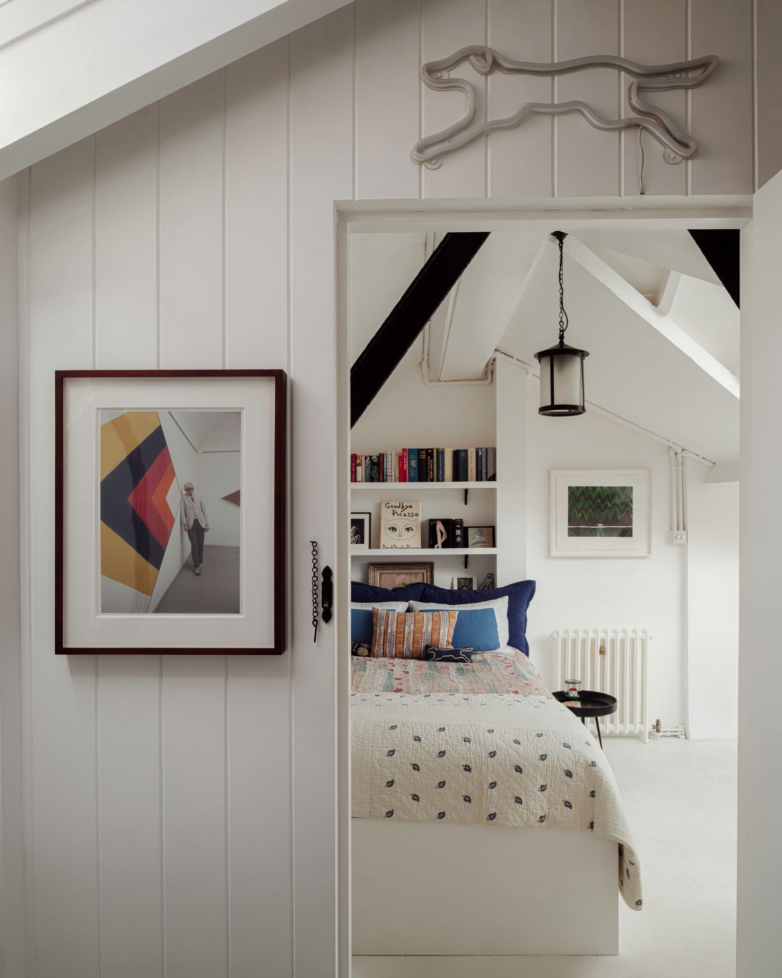 Looking out from the bathroom into the bedroom. A photograph of a young David Hockney taken by his dealer John Kasmin...