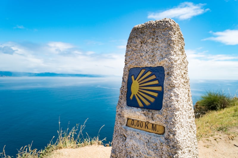 Camino de Santiago: The milestone at Finisterre lighthouse at the end of the St James Way 