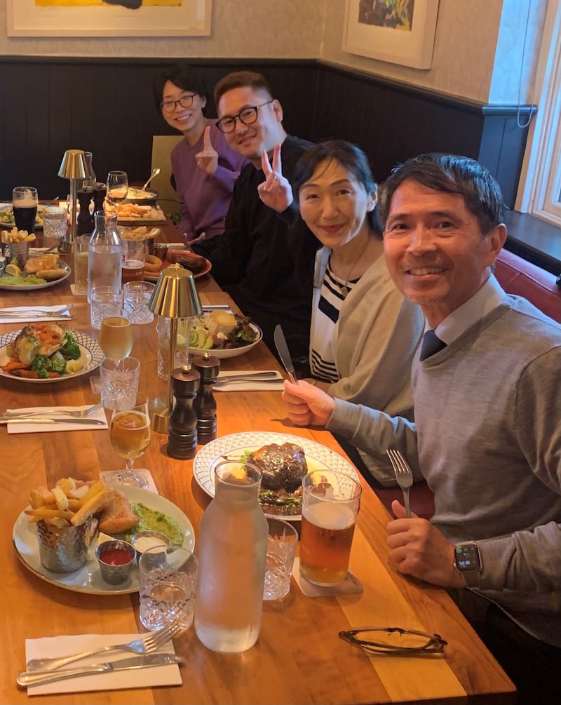 Norimasa Yoshida (front) dining with embassy colleagues at The Merrion Inn: 'The chicken fillet roll is a perfect blend of something new yet familiar'