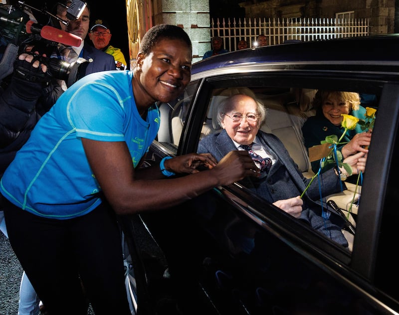 President Michael D Higgins is gifted a flower whilst leaving Aras an Uachtarain with his wife Sabina Higgins on Monday night. Photograph: Damien Eagers/PA Wire
