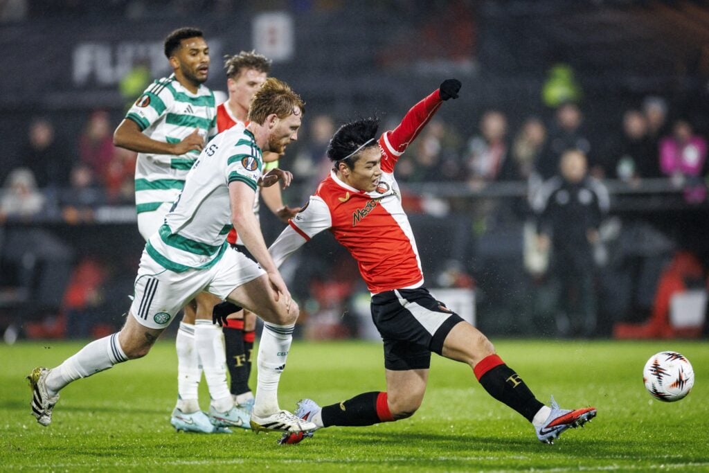 Liam Scales tries to tackle a Feyenoord defender during Celtic's Europa League clash