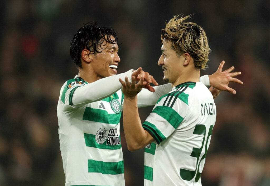 Reo Hatate and Daizen Maeda celebrate Celtic's second goal against Feyenoord