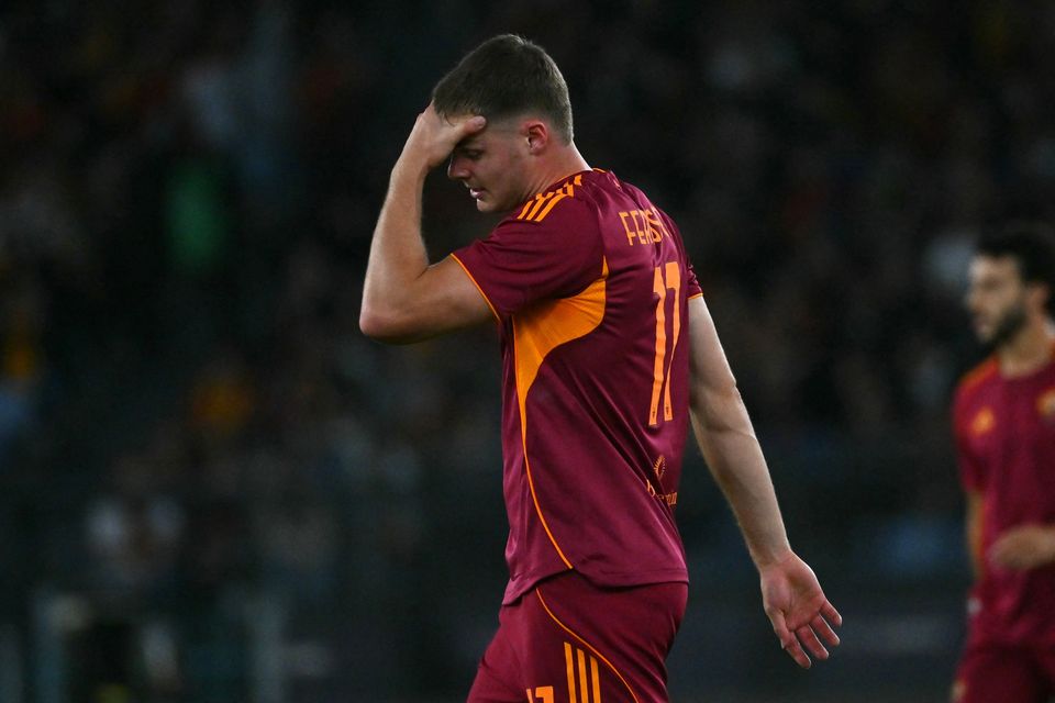 Roma's Irish forward #11 Evan Ferguson leaves the pitch injured during the Italian Serie A football match against  Parma. Picture: AFP via Getty Images