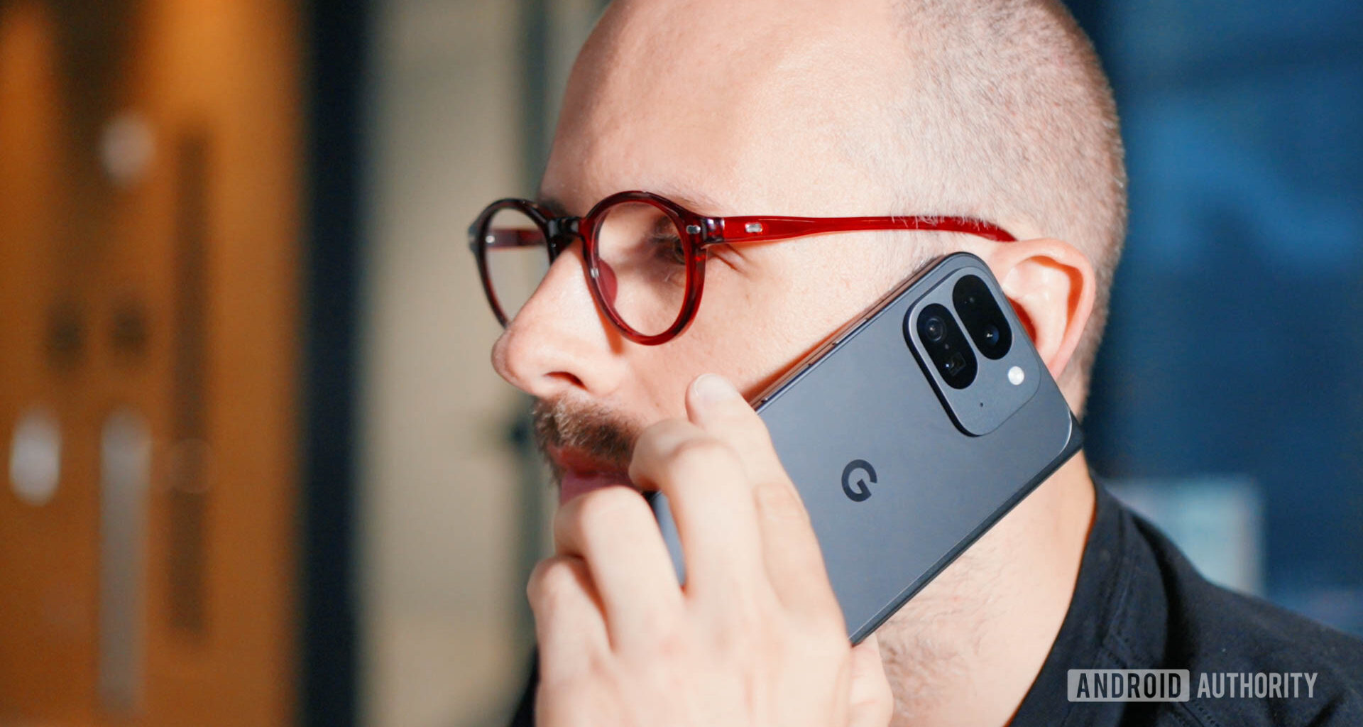 Google Pixel 9 Pro Fold in hand with man talking on the phone