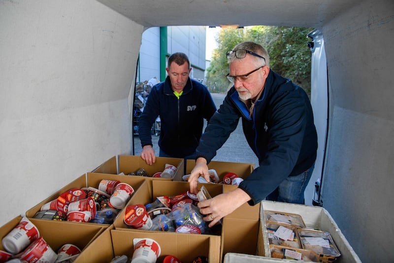 Volunteers William Goulding and driver John McGregor load a food delivery van at a St Vincent de Paul food bank in Cork city. Photograph: Daragh McSweeney/Provision