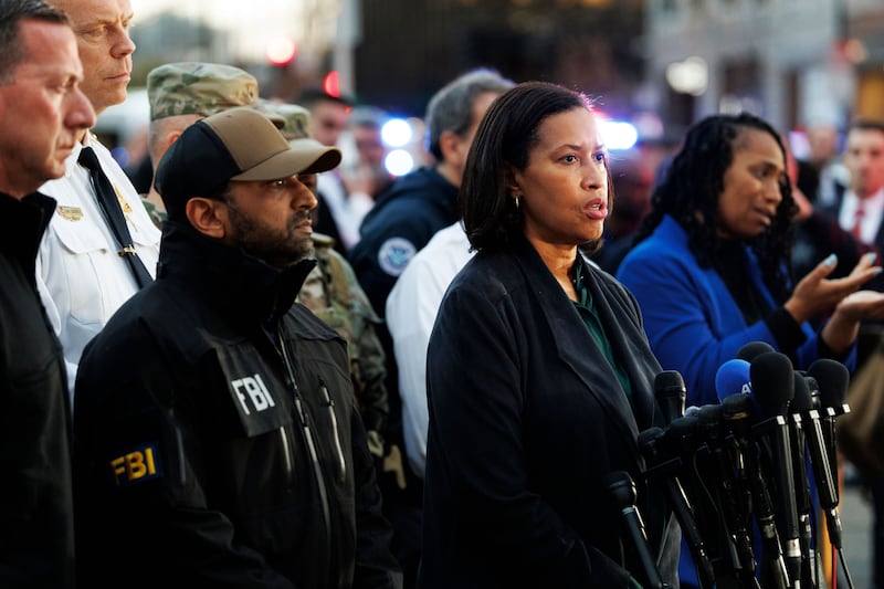 FBI director Kash Patel (left) and Muriel Bowser, mayor of Washington DC, hold a press conference close to the scene. Photograph: EPA