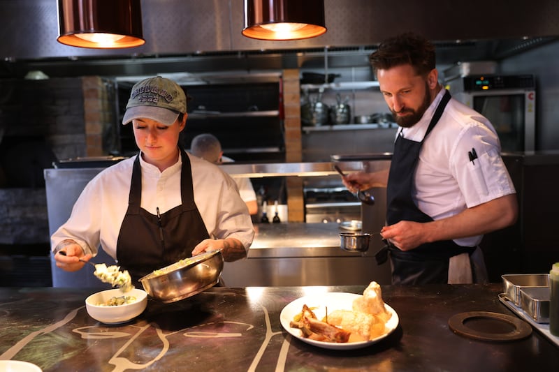 Keelan Higgs, (right) and Samantha Spodzieza at work in Variety Jones. Photograph: Dara Mac Dónaill