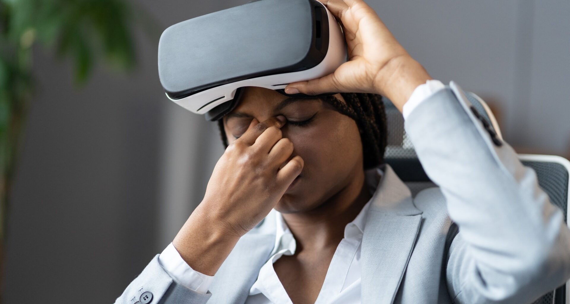 employee suffering from eye strain when using VR headset
