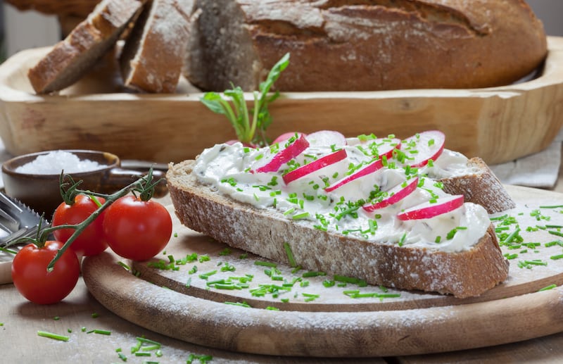 Traditional German bread with cream cheese and radishes