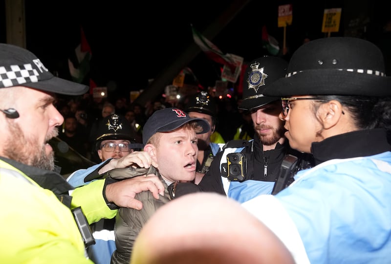 Police officers hold back fans outside Villa Park. Photograph: Joe Giddens/PA Wire