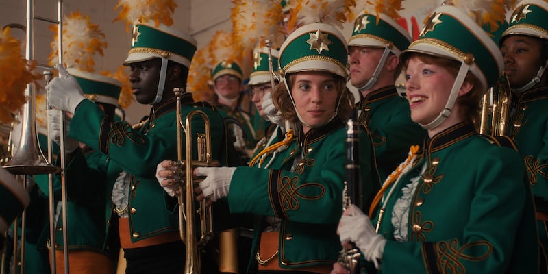 Maya Hawke (centre) as Robin Buckley and Amybeth McNulty (right) as Vickie in Stranger Things 