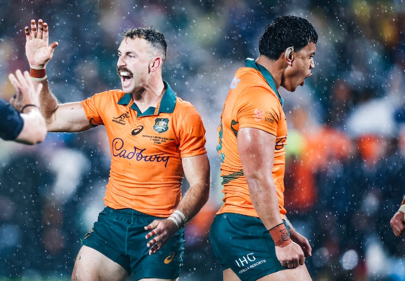 Australia's Nic White and Len Ikitau celebrate a turnover during the Wallabies' 22-12 victory over the Lions in August. Photograph: Tom Maher/INPHO