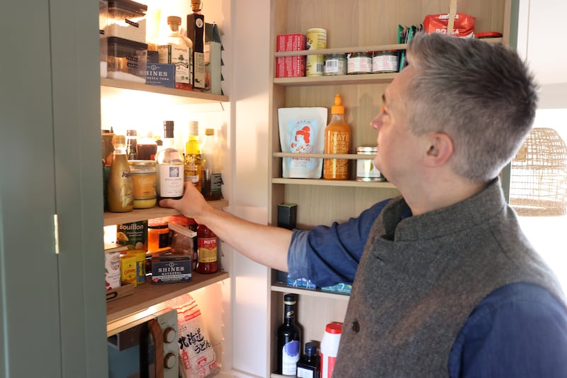 Adjustable shelves in the pantry cupboard of Skehan's Sutton home. Photograph: Dara Mac Dónaill







