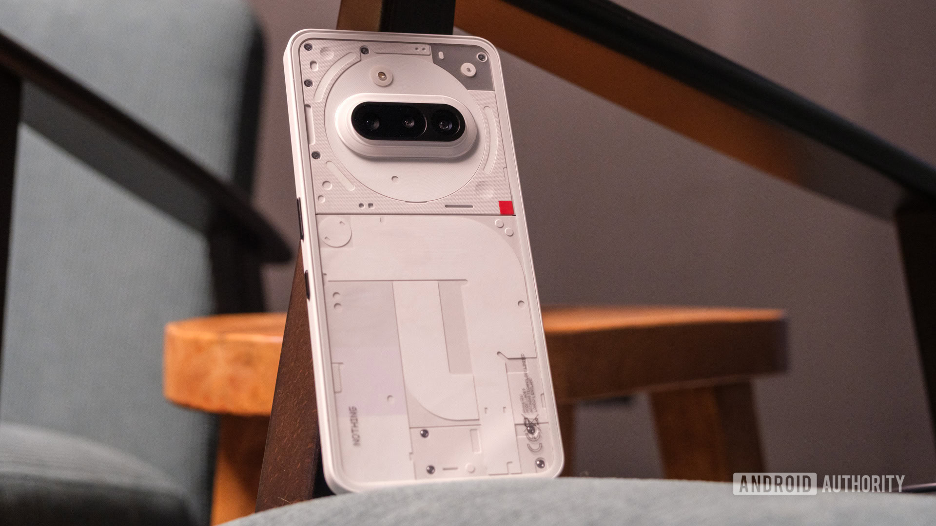 Nothing Phone 3a angled on chair Nothing Phone 3a angled on chair