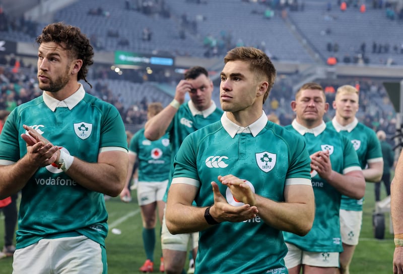 Caelan Doris and Jack Crowley applaud Ireland fans after the defeat. Photograph: Dan Sheridan/INPHO