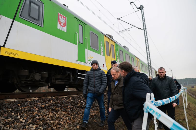 Polish prime minister Donald Tusk speaks with authorities at the site of the incident. Photograph: Chancellery of the prime minister via Getty Images