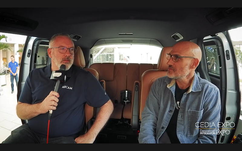 Jim Garrett and Josh Cooperman sitting inside the podcast van
