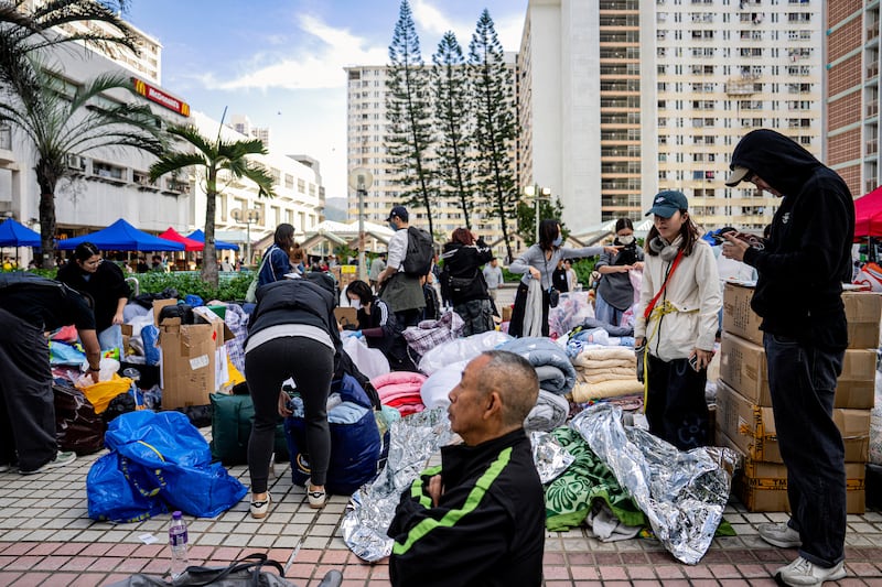 Volunteers sort donated supplies for residents displaced by the fire. Photograph: Leung Man Hei/Bloomberg