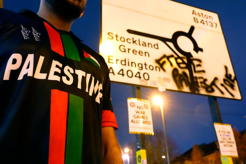 A fan in a Palestine football shirt standing outside Villa Park, Birmingham. Photograph: Nick Potts/PA Wire

RESTRICTIONS: Use subject to restrictions. Editorial use only, no commercial use without prior consent from rights holder.