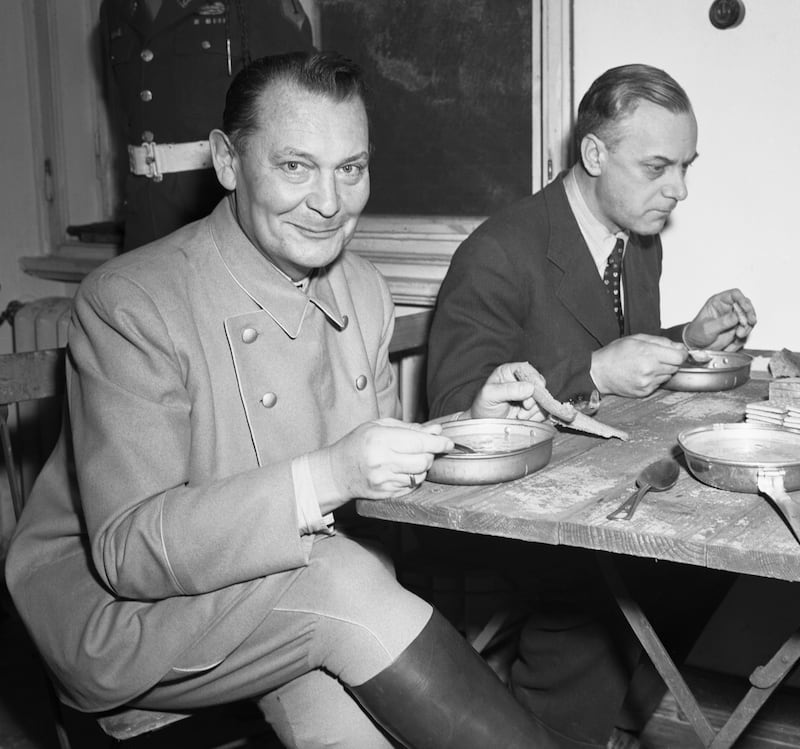 Hermann Göring offered 'a smile for the pressmen and paternal glances for his fellow prisoners'. Photograph: Getty Images
