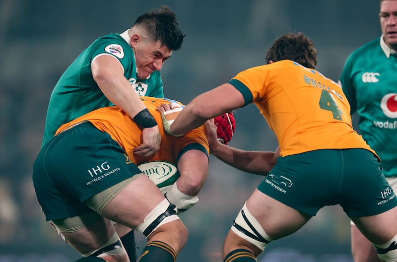 Ireland’s Dan Sheehan tackles Australia’s Harry Wilson. Photograph: Nick Elliott/Inpho