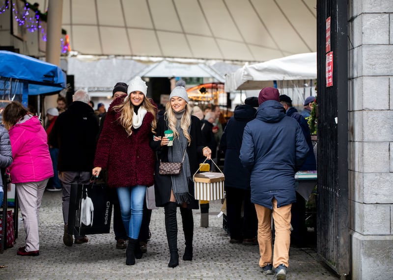 Members of the public enjoy Christmas at the Milk Market in Limerick. Photograph: Alan Place