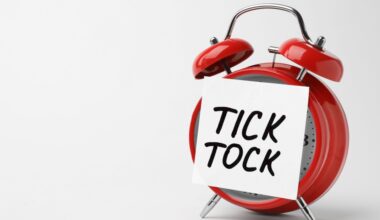 Red alarm clock with tick tock