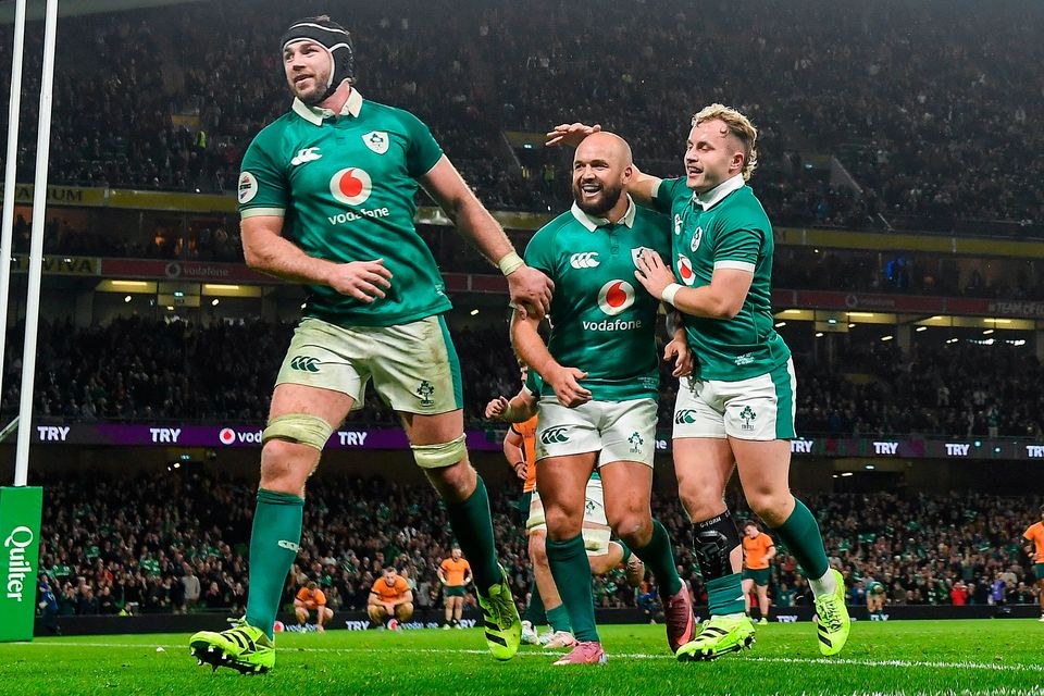 Ireland players, from left, Caelan Doris, Jamison Gibson-Park and Craig Casey celebrate their side's sixth try, scored by Robbie Henshaw, not pictured, in the Quilter Nations Series win over Australia at the Aviva Stadium in Dublin. Photo: David Fitzgerald/Sportsfile