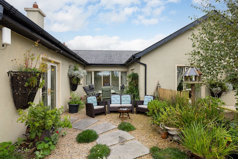 A courtyard is accessed from the kitchen and one of the bedrooms