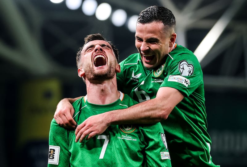 Ireland's Troy Parrott celebrates scoring his side's second goal with Josh Cullen. Photograph: Ryan Byrne/Inpho
