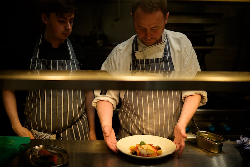 Conor Sheridan and Peter Everett at work in Everett's, Waterford