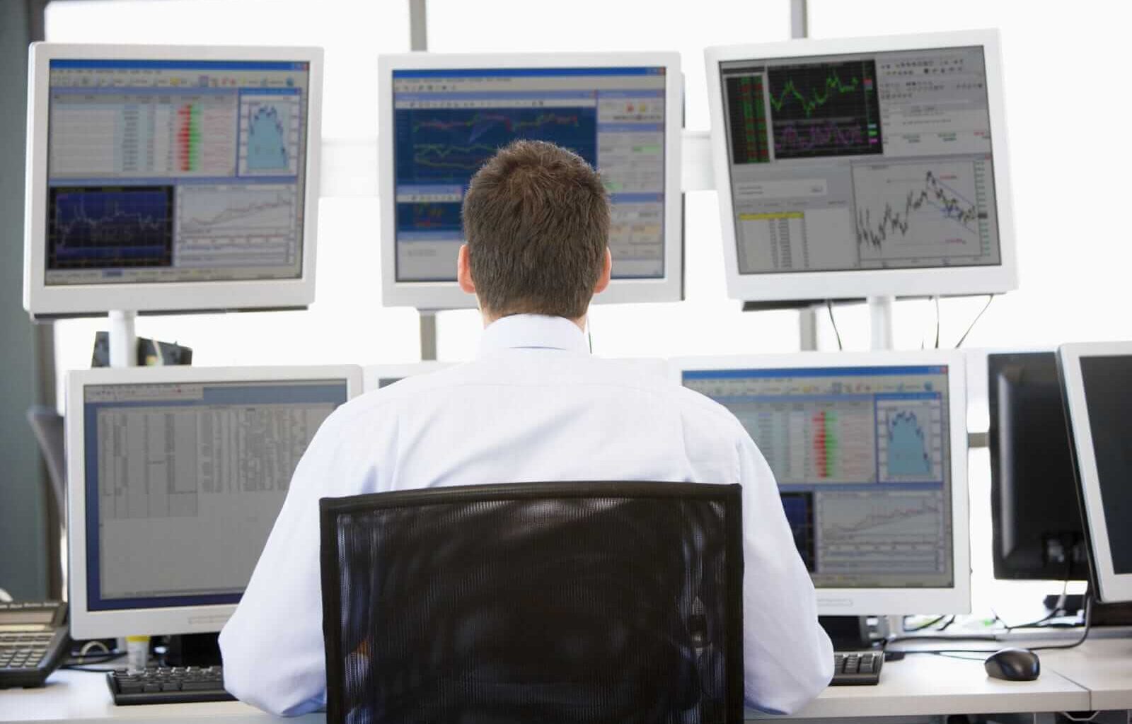 Trader at office - by Viktoriia Hnatiuk via Shutterstock