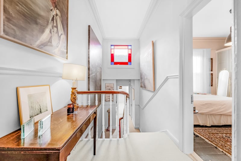 Landing with restored stained-glass window