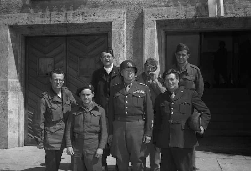 Gen George Patton, commander of the US third army in Europe, holds a press conference with journalists after Germany's surrender. Seaghan Maynes is to the left, in the front row. Photograph: Bettmann archive
