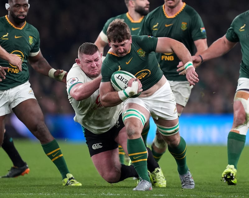 South Africa's Kwagga Smith (right) is tackled by Ireland's Tadhg Furlong. Photograph: Niall Carson/PA