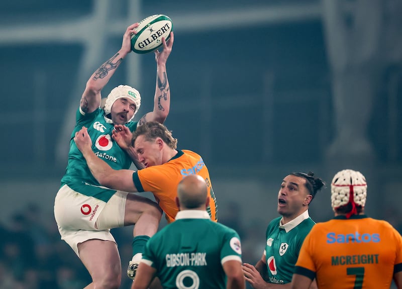 Ireland’s Mack Hansen gets to a high ball ahead of Australia’s Max Jorgensen during Saturday's Test at the Aviva Stadium. Photograph: Nick Elliott/Inpho