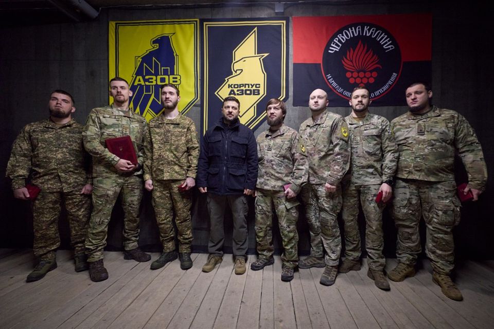 Ukrainian President Volodymyr Zelensky, centre, pose for a photo with servicemen near the frontline city of Pokrovsk, Donetsk region (Ukrainian Presidential Press Office/AP)