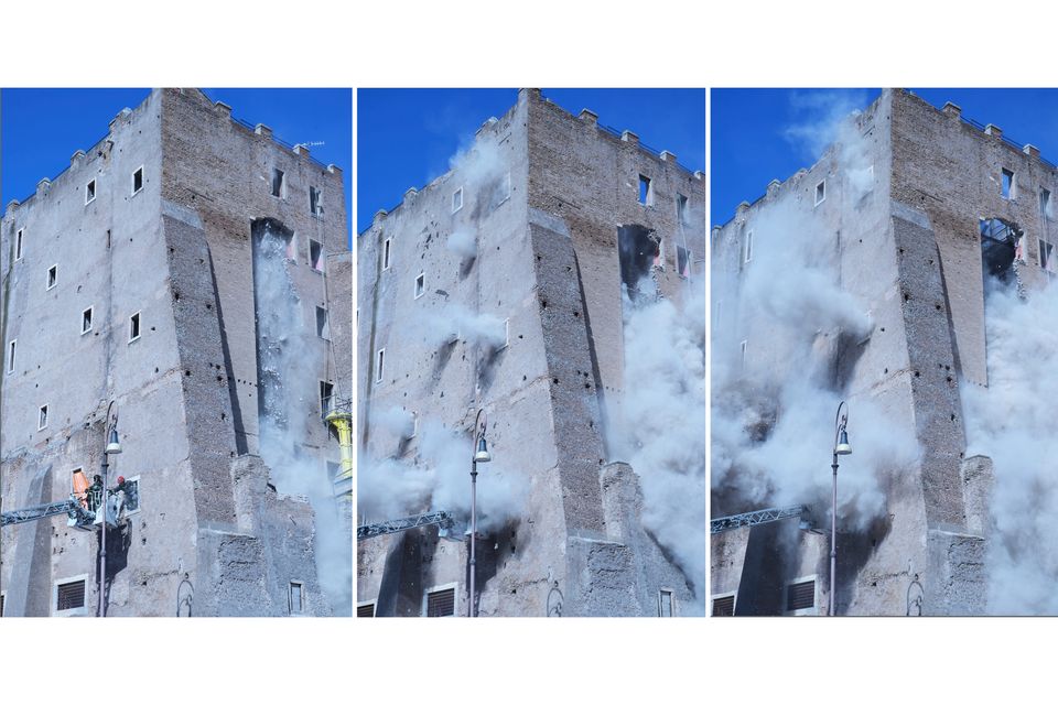 A cloud of debris after a medieval tower partially collapsed during renovation work in Rome (Domenico Stinellis/AP)