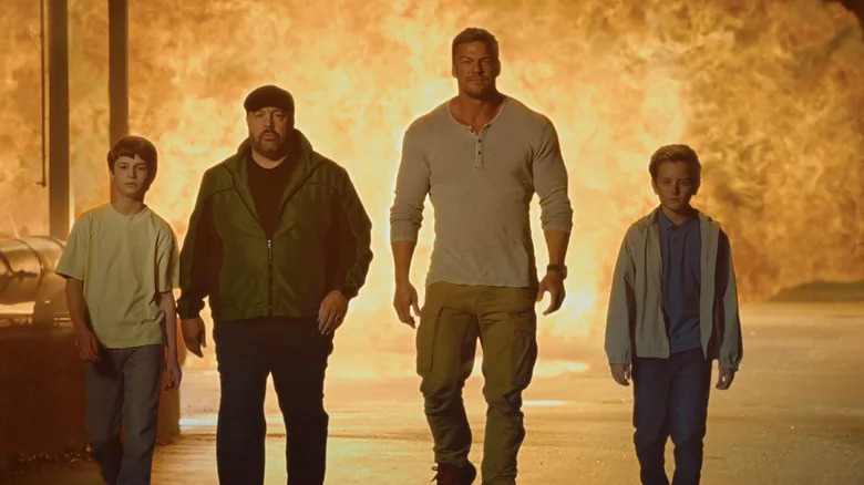 Benjamin Pajak's Lucas, Kevin James' Brian, Alan Ritchson's Jeff, and  Banks Pierce's CJ walk away from an explosion in Playdate
