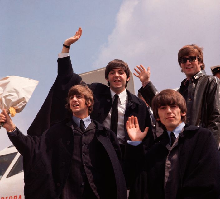The Beatles pictured on their arrival in London following a tour of Australia in 1964. Fox Photos/Getty Images