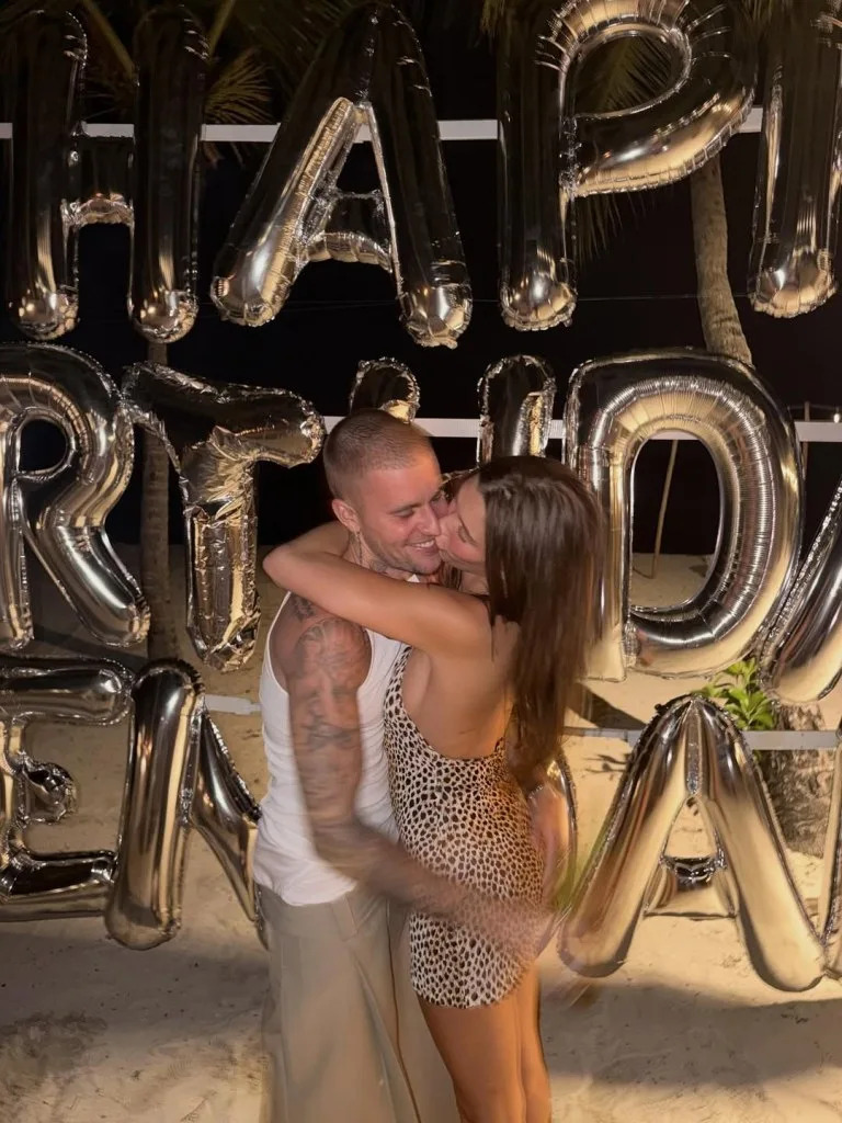 Justin Bieber and his wife, Hailey Bieber, shared a sweet kiss at Kendall Jenner’s 30th birthday party on Monday night. Instagram/