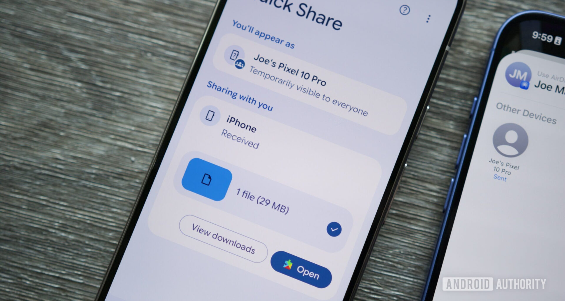 A Pixel receiving a file from an iPhone via Quick Share and AirDrop.