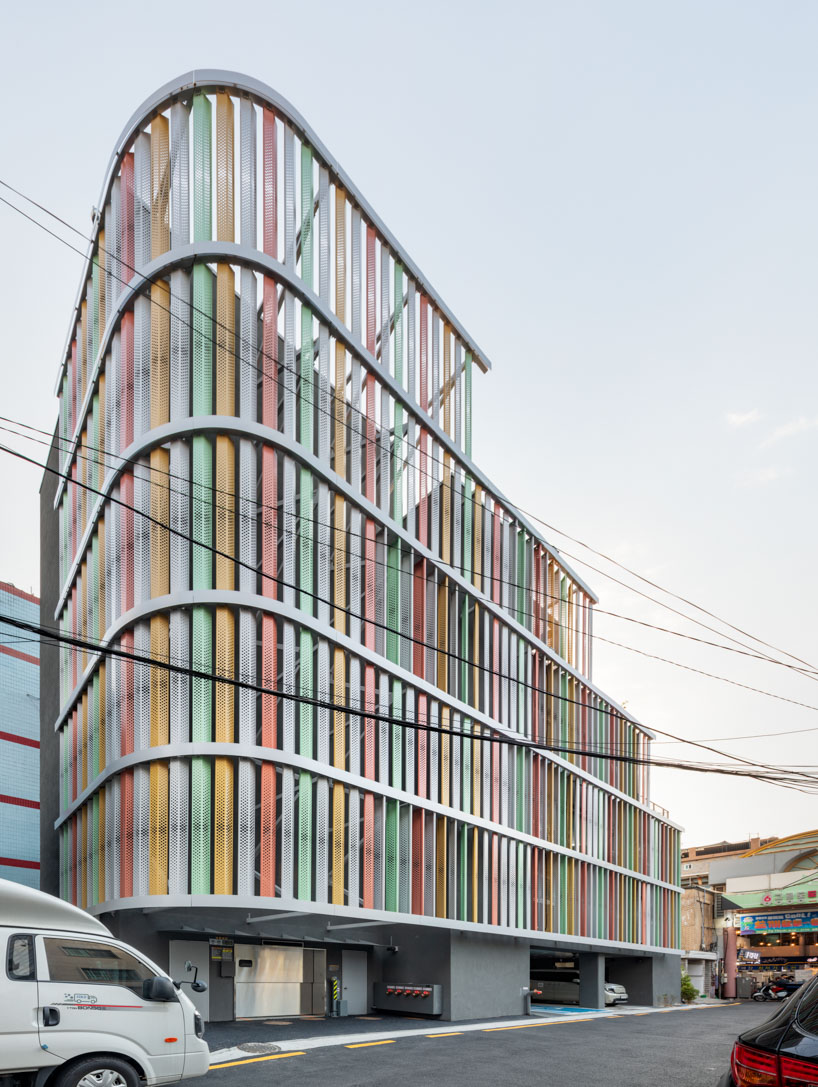 translucent facade of multicolored steel louvers unfolds along seoul’s dokkaebi market