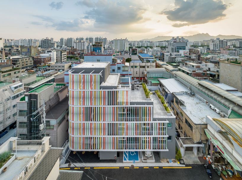 translucent facade of multicolored steel louvers unfolds along seoul’s dokkaebi market