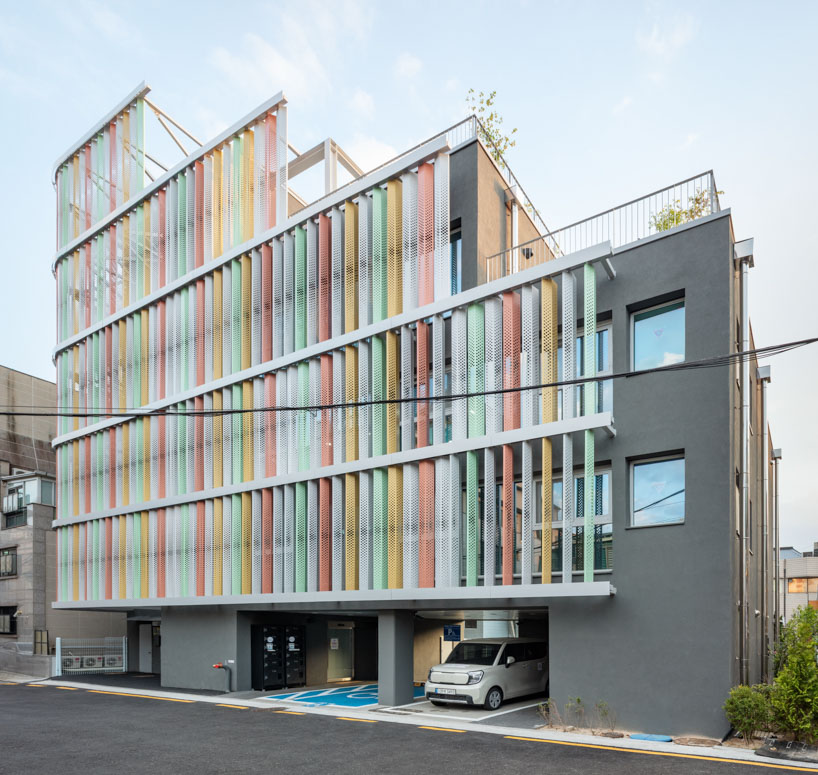 translucent facade of multicolored steel louvers unfolds along seoul’s dokkaebi market