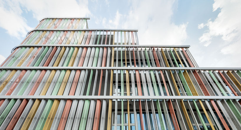 translucent facade of multicolored steel louvers unfolds along seoul’s dokkaebi market