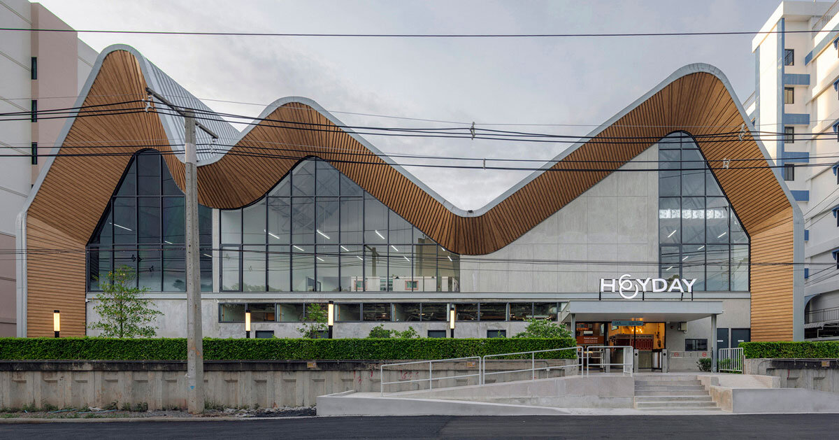 three curved gable roofs top ASWA’s community hub in thailand