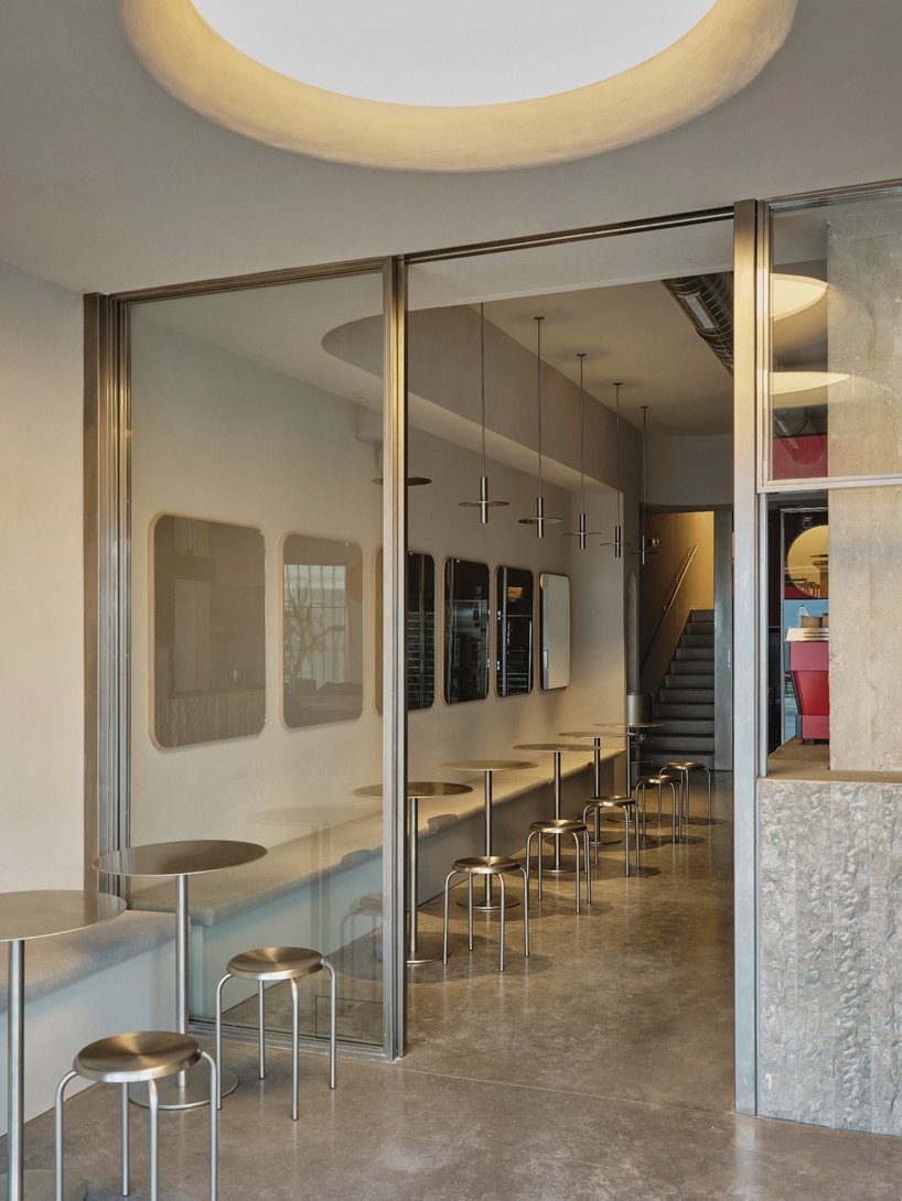 café's curved interiors by zooco estudio reflect art deco siboney building in spain